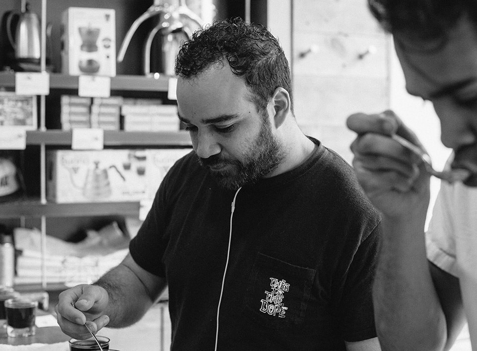 Mazi Razani cupping with the team at Blueprint Coffee.