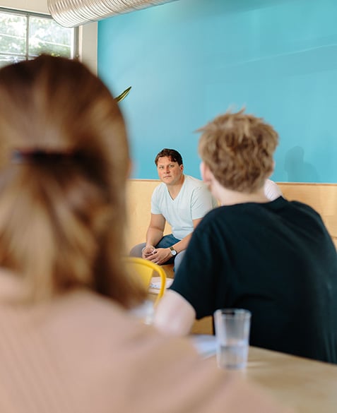 Mike listens to questions from the staff.
