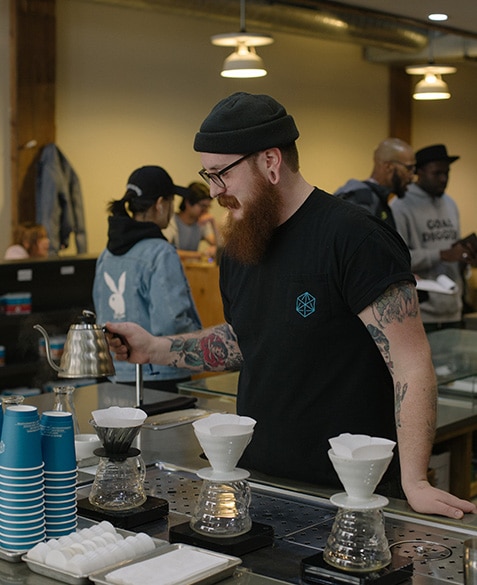 ryan stakes brews a coffee at blueprint coffee delmar
