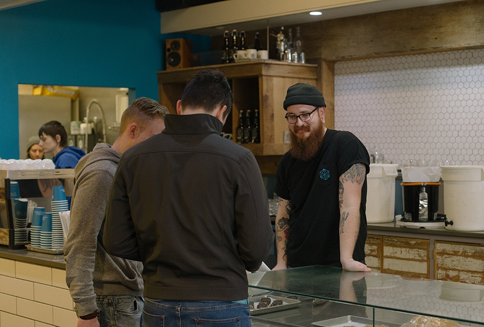 Then, he waits on patrons.