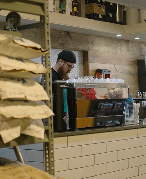 ryan stakes prepares espresso drinks at blueprint coffee delmar