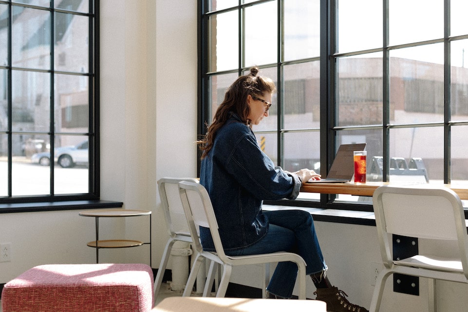 Nora Brady works on her computer at the High Low location